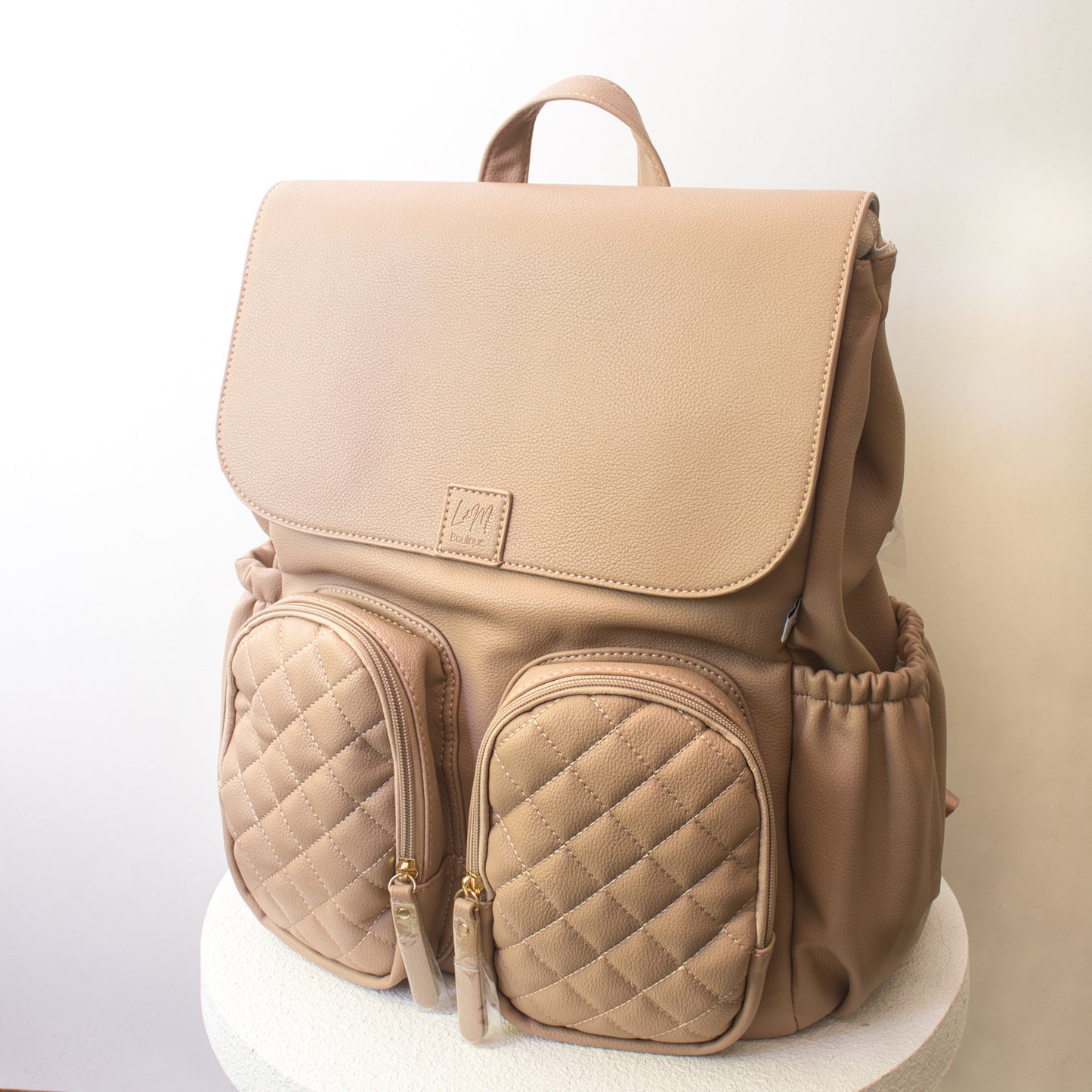 cream colour nappy bag with front pockets
